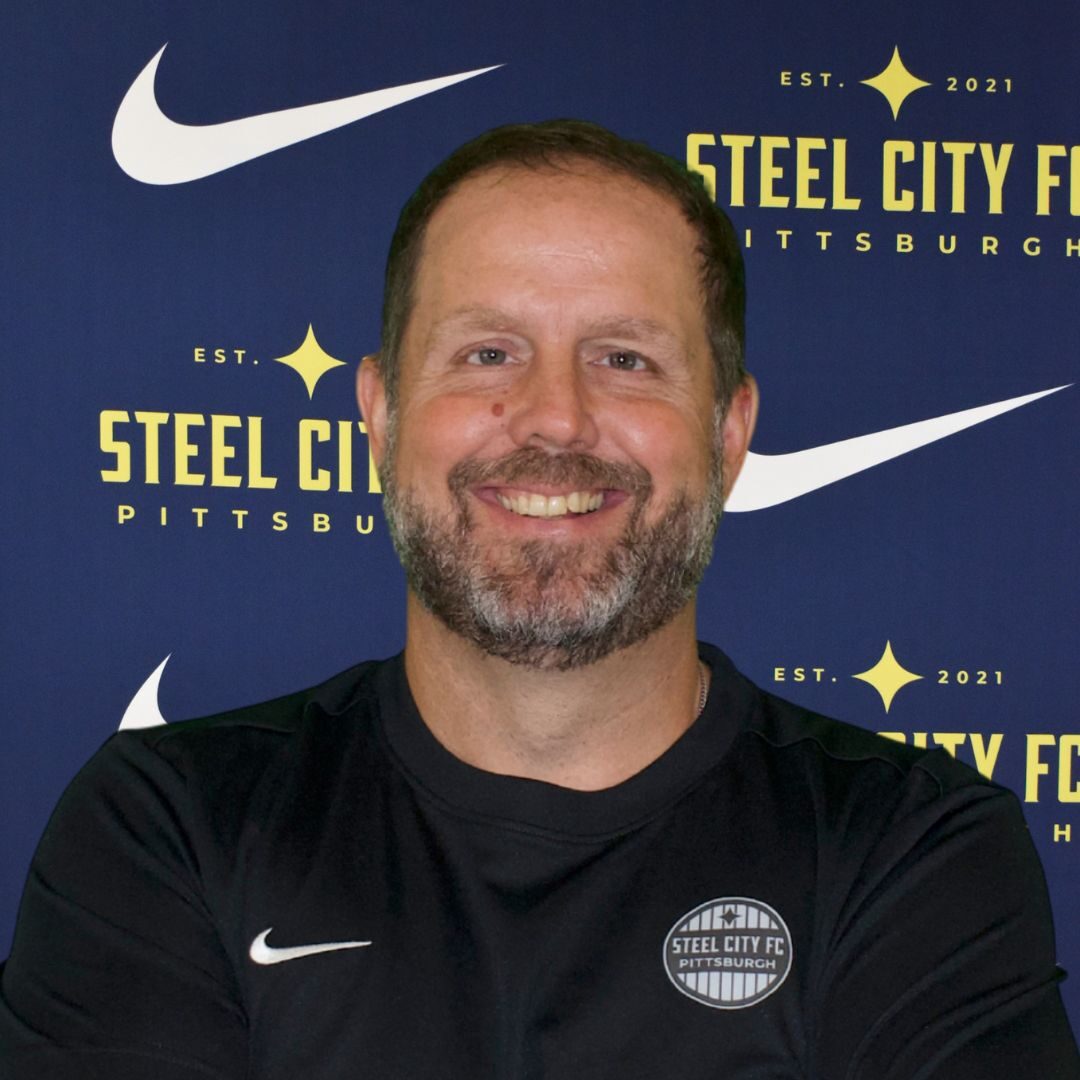 <br><strong>Qualifications: </strong>USSF B, NSCAA Advanced National Diploma, NSCAA National Diploma<br><br>
<strong>Hometown: </strong>Pittsburgh, PA<br>
<strong>Supports: </strong>Manchester United<br><strong>Primary position: </strong>Center Back<br><br>
<strong>About: </strong>Captain of Pittsburgh Strikers '76 Blue team, 7 state championships, two Region 1 championships, 1992 USYS National Silver Medalist. Played collegiate soccer at WVU.